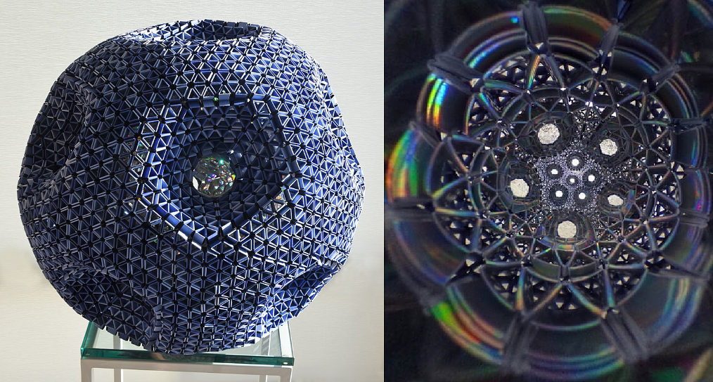 Big Boy Blue (2020), snapology origami sculpture of an eleven-holed torus from by David Honda.